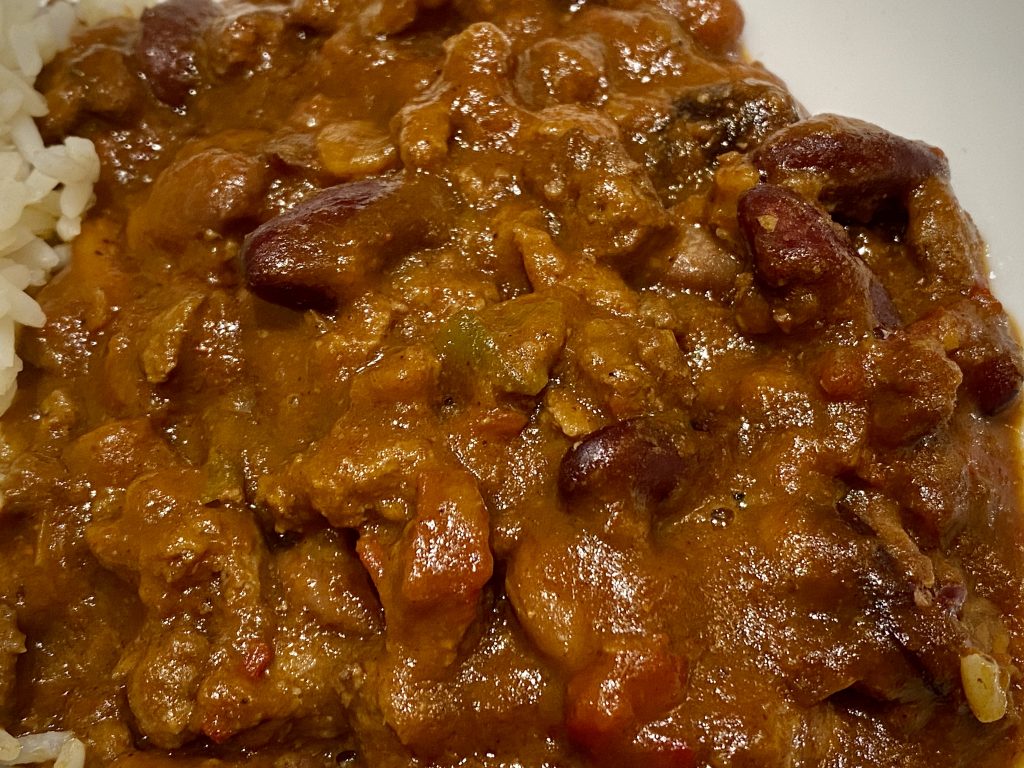 A close-up shot of a chilli con carne; its ingredients are easily discernible.